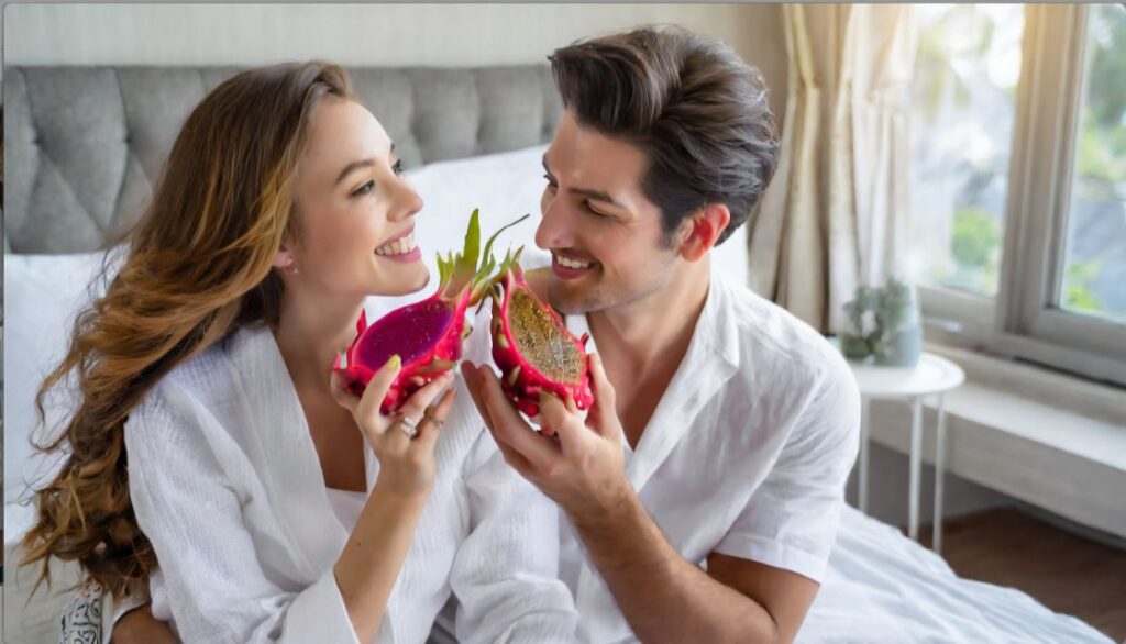 Couple eating red dragon fruit